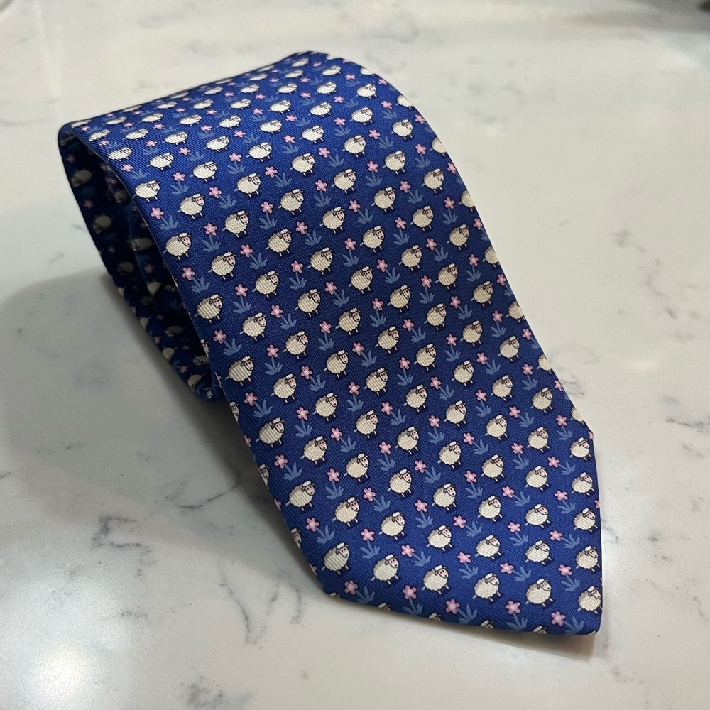 Never worn men’s silk necktie by Salvatore Ferragamo with sheep pattern.